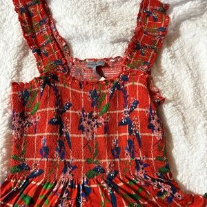 Red Floral Smocked top 
Anthropologie.